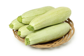 raw zucchinis in basket isolated