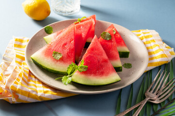 Fresh slices of red watermelon in a plate. Summer fruits