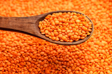 Red lentils and wooden spoon