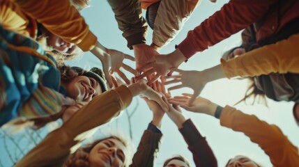 A group of people standing in a circle, all holding hands together