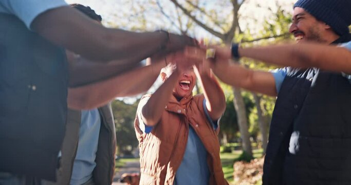 Volunteers, hands and pile for teamwork in outdoors, motivation and group for social responsibility. People, clapping and support for community service, non profit outreach and agreement in nature