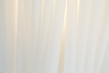 White sculptural papercraft lamp. Mid-century modern decor. Close-up photograph.
