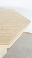 Vintage hexagonal stone dining table. Closeup detail photograph.