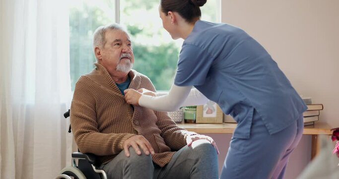 Nurse, mature man and hands for help dressing in retirement home with support, assistance and conversation. Healthcare, caregiver and senior male person with disability in wheelchair for comfort