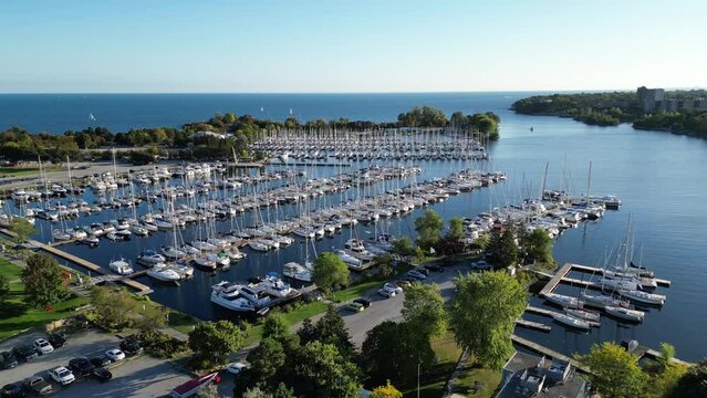 Aerial drone footage of marina sail boats in Humber Bay Etobicoke Toronto on a sunny day with blue sky. Lake Ontario