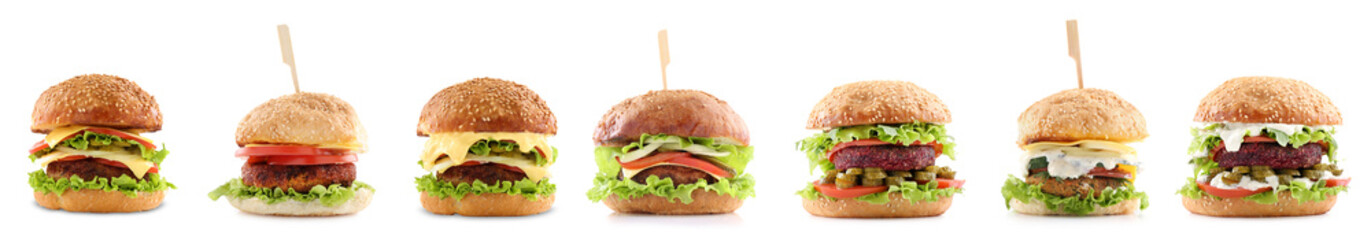 Different delicious vegetarian burgers isolated on white, set