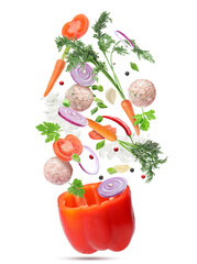 Stuffed pepper recipe. Fresh ingredients falling into bell pepper on white background