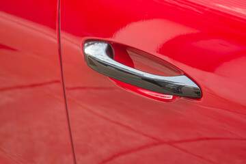 Door handle on a red car