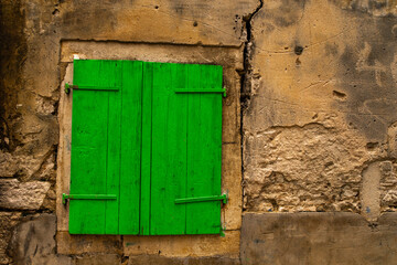 Green shutter renovation of a building in the old town