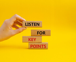 Key points symbol. Wooden blocks with words Listen for Key points. Businessman hand. Beautiful yellow background. Business and Listen for Key points concept. Copy space.