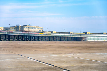 Clear blue skies over the historic Berlin Tempelhof Airport in Germany, showcasing the vast airport...