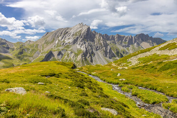 Naklejka premium Chamonix Montblanc beautiful alpine mountain summits landscape. Alps mountains with snow and glacier above green valley of Chamonix in France. Alps beautiful scenery in summer