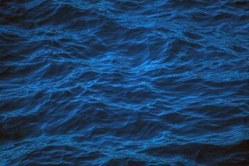 An abstract background of seawater flow under light exposure