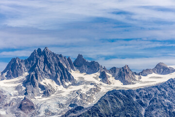 Chamonix Montblanc beautiful alpine mountain summits landscape. Alps mountains with snow and glacier above green valley of Chamonix in France. Alps beautiful scenery in summer