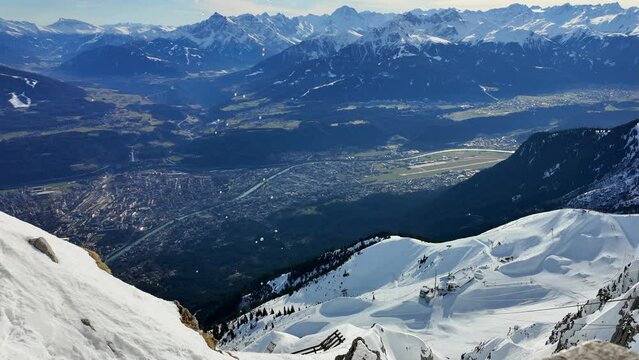 View over the Innsbruck valley from the snow-covered Nordkette, Tyrol, Austria