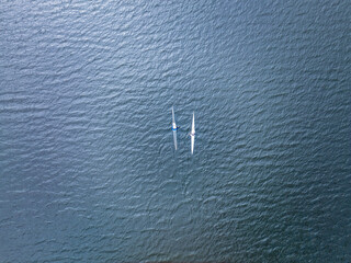 Kayaking top view. Group of kayaks rowing. Aerial view from drone.