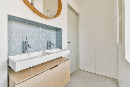 Modern bathroom with double sink and hexagonal tiles