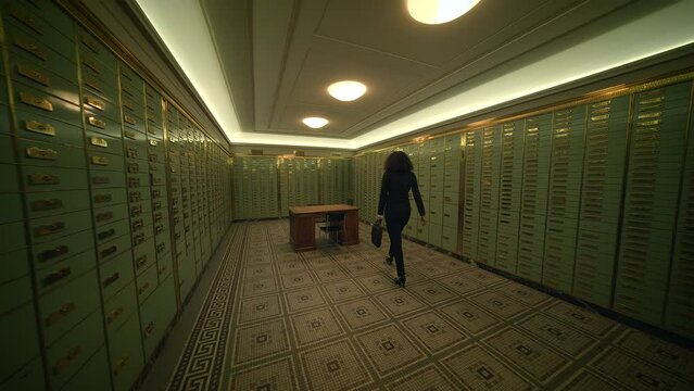 An old bank vault with safe deposit boxes and a person inside, symbolizing a financial institution