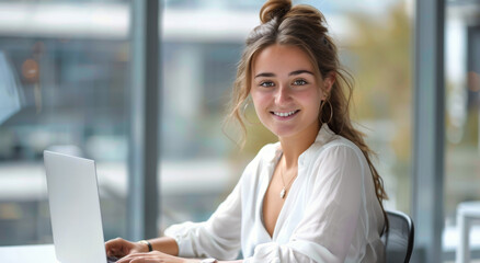 Fototapeta premium Woman Sitting in Front of Laptop Computer