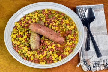 baked beans, corn and peas  served with italian sausage