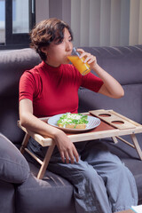 Young girl drinking orange juice, traditional mexican food