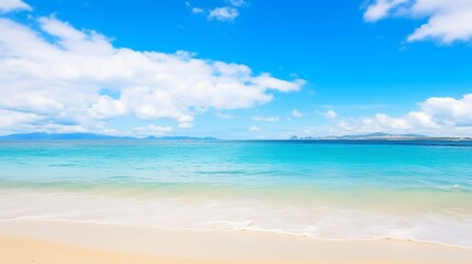 A Beautiful Beach Scene with Tranquil Turquoise Waters and White Sand Under a Blue Sky