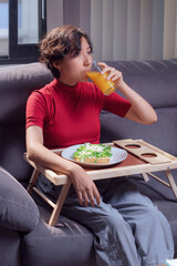 Young girl drinking orange juice, traditional mexican food