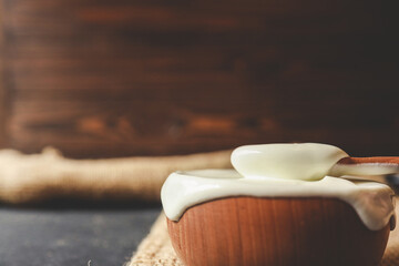Homemade yogurt or sour cream in a wooden bowl, Health food from yogurt concept