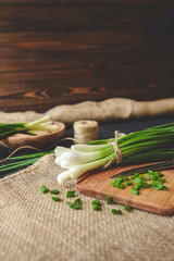 Fresh green onions on a cutting board