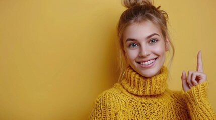 Young Woman Smiling In Yellow Sweater Against Yellow Wall