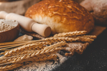 Freshly baked homemade bread and ears of wheat