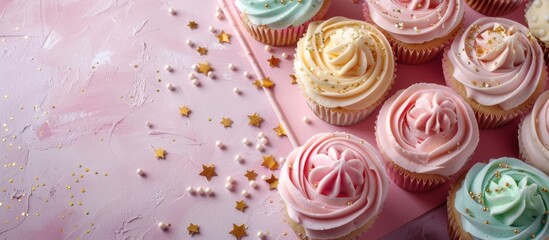 Pink table with cupcakes and notebook