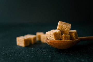 brown sugar heap and wooden spoon