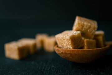 brown sugar heap and wooden spoon