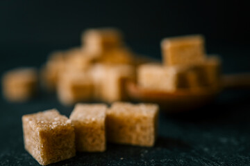 brown sugar heap and wooden spoon