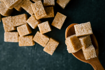 brown sugar heap and wooden spoon