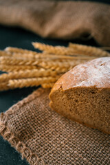 Freshly baked homemade bread and ears of wheat