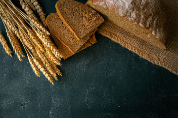 Freshly baked homemade bread and ears of wheat