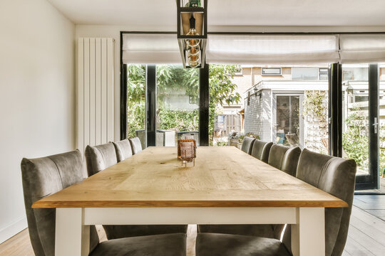 Modern dining room in Amsterdam home with garden view