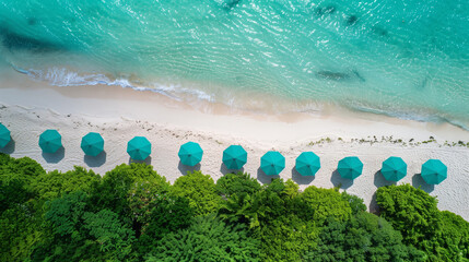 Aerial view of the crystal clear blue ocean, white sand beach, green palm trees and turquoise umbrellas - Powered by Adobe