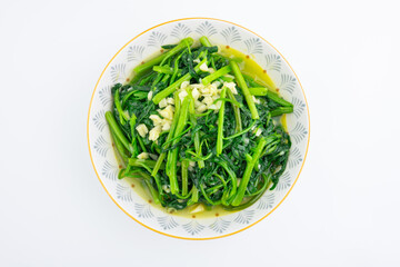 A dish of garlic water spinach