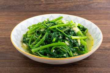 A dish of garlic water spinach