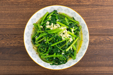 A dish of garlic water spinach