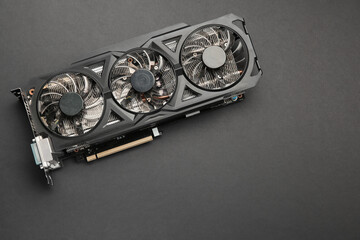 One graphics card on black background, top view. Space for text