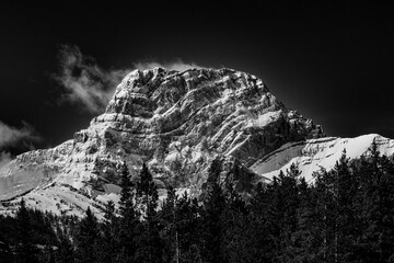 Snow covered peak in Canadian Rockies, on George Biggy Sr Road, Dead Man's Flats, Alberta, Canada