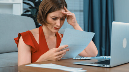 Stressed young woman has financial problems with credit card debt to pay prim from bad personal...