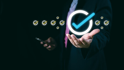 Service guarantee, clients service, businessman hand showing guarantee check mark for business automation process, quality assurance management, certification, online shopping, financial ecosystem.