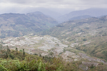 Fototapeta premium Panoramic image of the rice terraces in Laohuuzui area in Honghe Hani, China