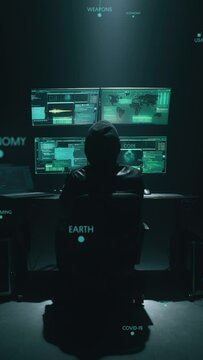 Conceptual shot of a hacker who commits a massive terrorist cyber attack, a crime to influence politics or steal personal data or government secrets. Vertical shot.
