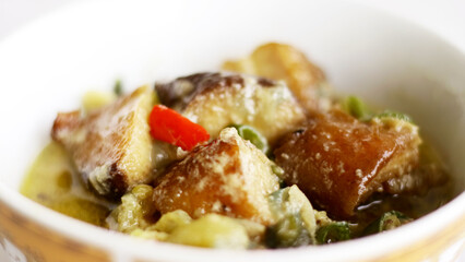 Mangut of smoked stingray or smoked fish in a spicy and creamy sauce. Mangut ikan pari. Indonesian food.